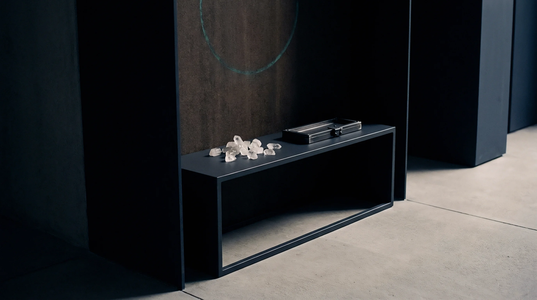 Quartz crystal substrates and a metal instrument housing rest on a monolithic dark display stand within a controlled industrial testing laboratory environment.